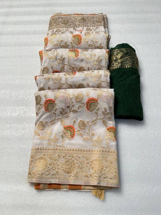 Folded off-white khadi georgette silk saree displaying golden zari floral weaving and border details