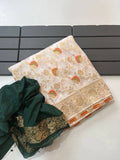 Neatly arranged stack of a cream khadi silk saree highlighting its intricate gold borders and modern ethnic styling