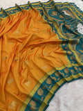 Elegant orange silk Paithani saree for women featuring woven teal border and ethnic lotus motifs.