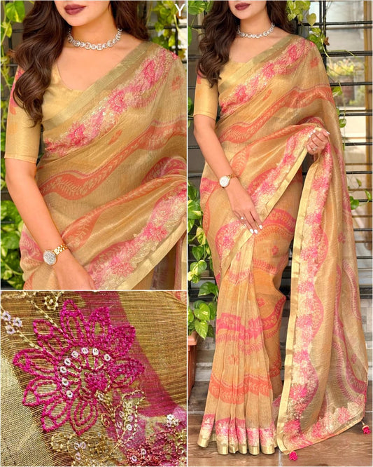 Beige gold designer saree with floral printed patterns and elegant woven border.