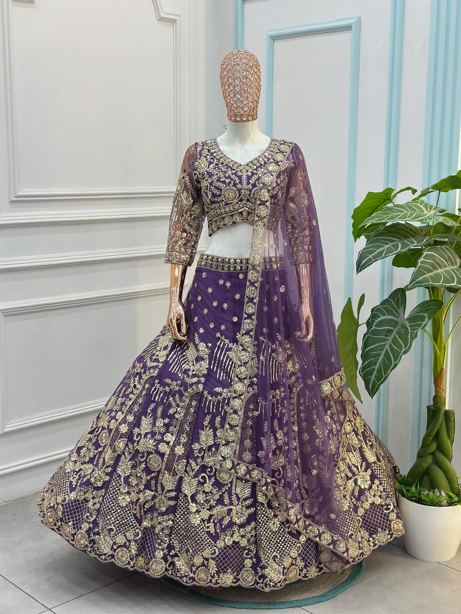 Purple net dupatta with embellished gold embroidered border and small sequin motifs.