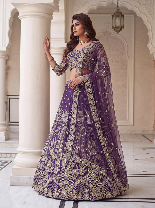 Close-up of v-neck purple choli blouse with intricate gold needlework and sheer sleeves