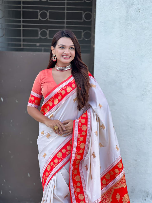 Elegant white silk saree for women featuring pink woven border and authentic Paithani craftsmanship.