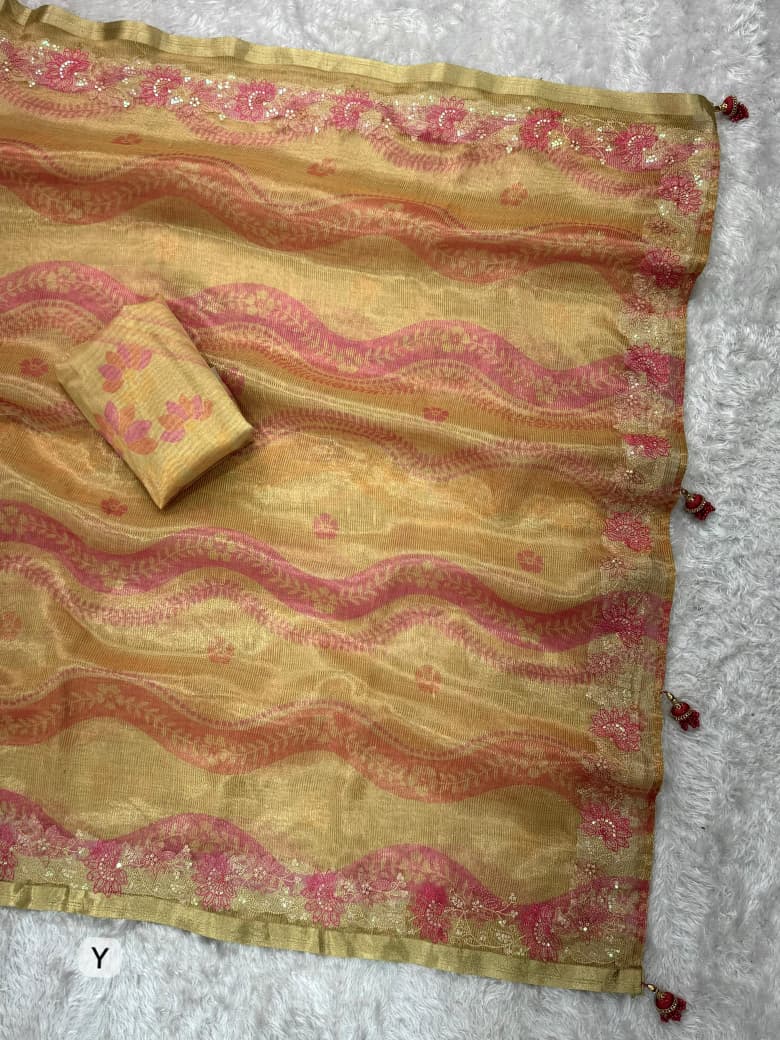 Elegant party wear beige gold saree with luxurious ethnic detailing.