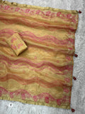 Elegant party wear beige gold saree with luxurious ethnic detailing.