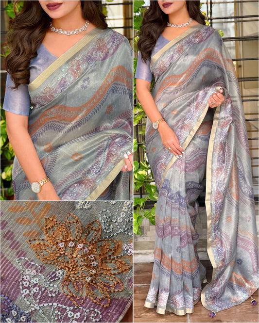 Designer grey floral saree in premium linen silk fabric for festive and party wear.