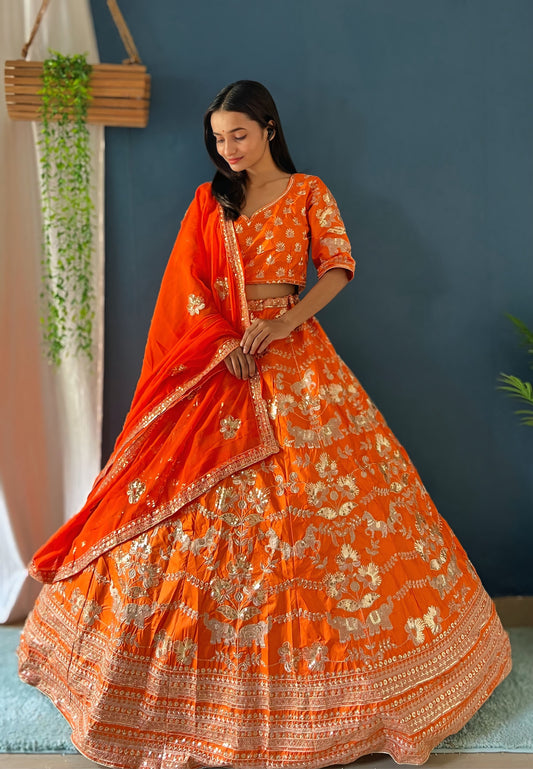 Royal Orange Bridal Lehenga Choli with Heavy Golden Embroidery