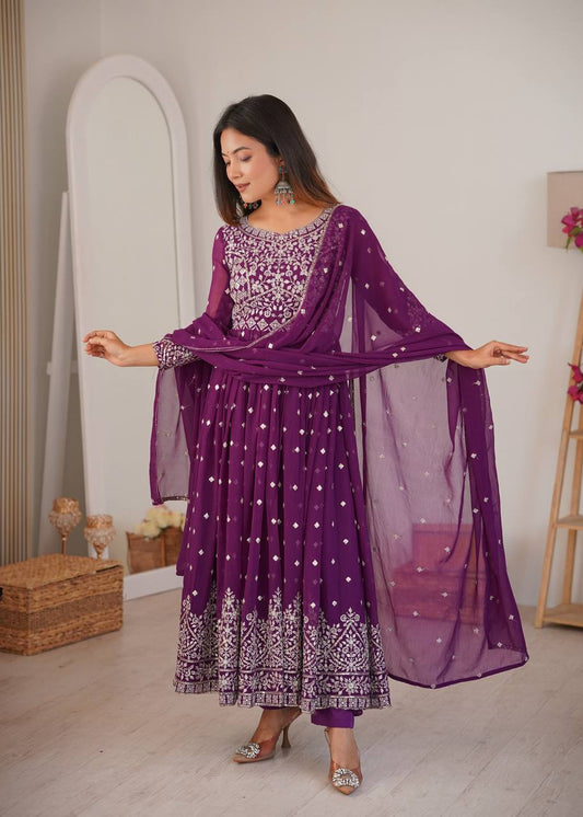 Woman wearing royal purple embroidered Anarkali suit with matching dupatta