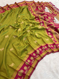 Beautiful olive green ethnic saree with pink lotus pallu and traditional zari work
