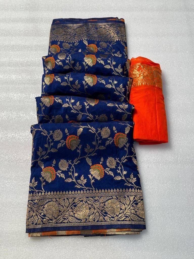 Royal blue pure georgette silk saree laid flat next to a folded bright orange woven blouse piece