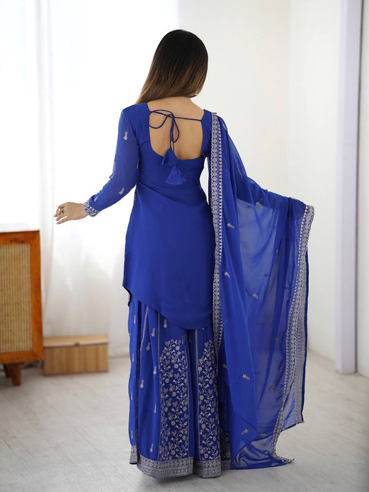Close-up of heavy sequins and thread embroidery work on a royal blue faux georgette ethnic kurta