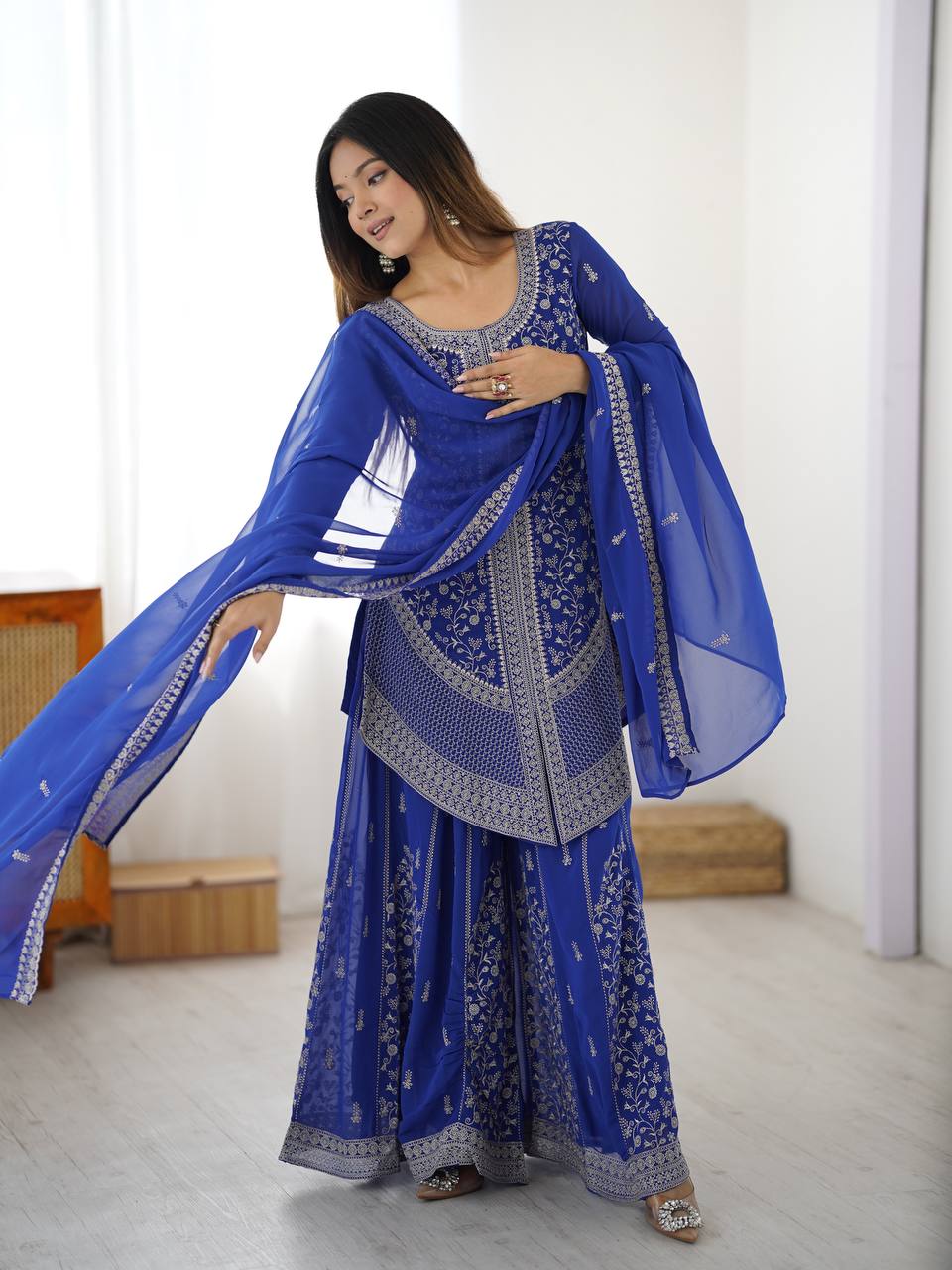 Traditional royal blue embroidered sharara suit styled as elegant festive and wedding wear for women