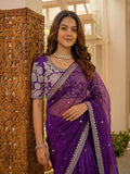 Women wearing luxury purple ethnic saree with embroidered detailing