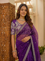 Women wearing luxury purple ethnic saree with embroidered detailing