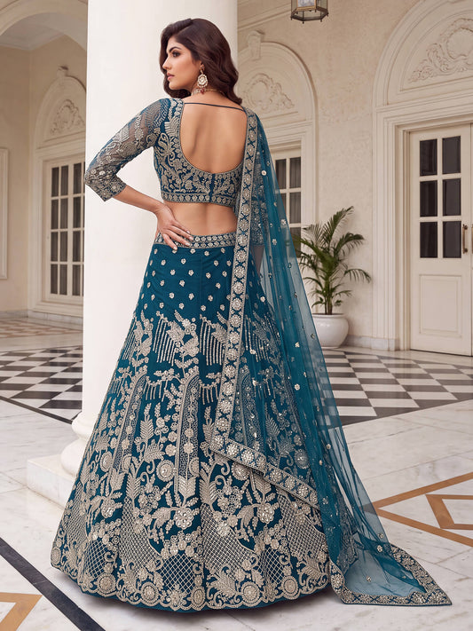 Close-up of teal blue v-neck blouse featuring intricate gold threadwork and embroidered full sleeves.