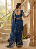 Elegant Indian blue saree with detailed embroidery and sheer drape