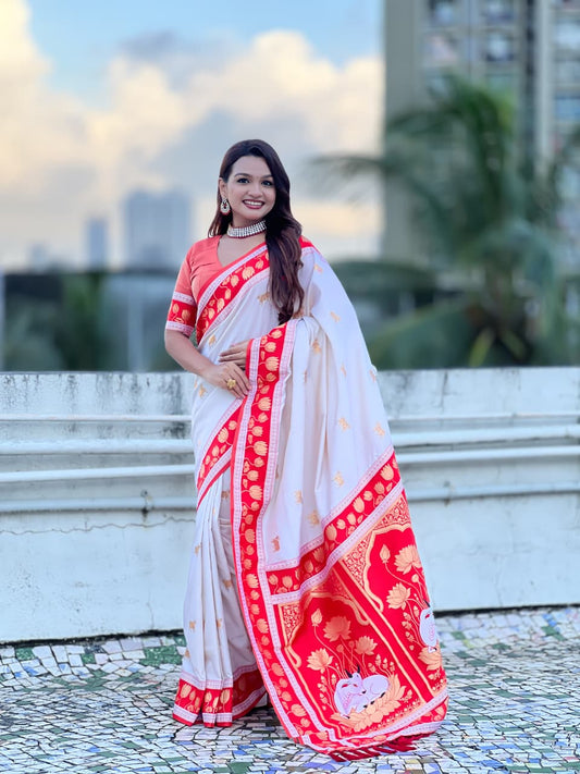 Pearl white Paithani silk saree with coral pink lotus zari border and traditional Maharashtrian pallu design.